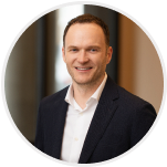 Black-and-white headshot of Alex Calaf, VP of Plan Administration.